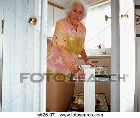 Elderly woman with hostess trolley View Large Photo Image Stock Image - Elderly woman with hostess trolley. Fotosearch