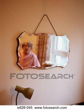 Reflection of elderly woman in mirror View Large Photo Image Stock Photography - Reflection of elderly woman in mirror . Fotosearch