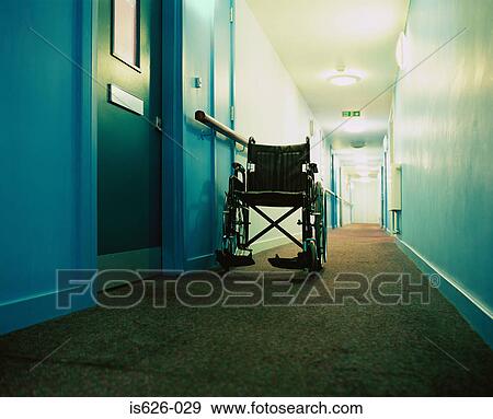 Stock Photo - Wheelchair in a corridor. Fotosearch