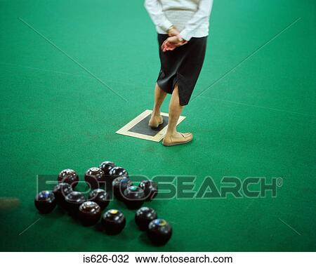Woman on indoor bowling green View Large Photo Image Stock Image - Woman on indoor bowling green. Fotosearch