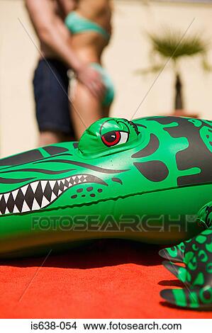 Couple and inflatable crocodile View Large Photo Image Picture - Couple and inflatable crocodile. Fotosearch