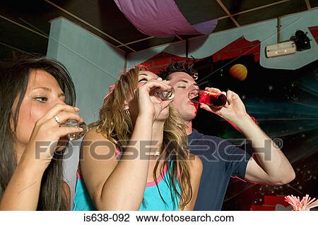 Friends drinking shots View Large Photo Image Stock Image - Friends drinking shots. Fotosearch