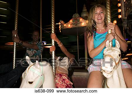 Friends on carousel View Large Photo Image Stock Photo - Friends on carousel . Fotosearch