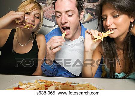Friends sharing french fries View Large Photo Image Stock Photography - Friends sharing french fries. Fotosearch