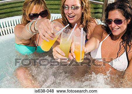 Three women in a hot tub View Large Photo Image Stock Photo - Three women in a hot tub. Fotosearch