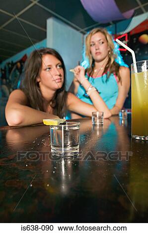 Stock Image - Two drunk women. Fotosearch