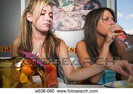 Two women with food and cocktails View Large Photo Image Stock Image - Two women with food and cocktails . Fotosearch