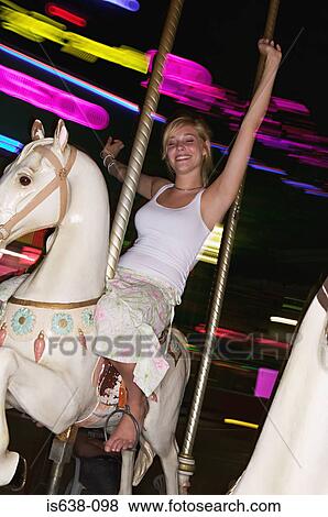 Woman on carousel View Large Photo Image Stock Photo - Woman on carousel. Fotosearch