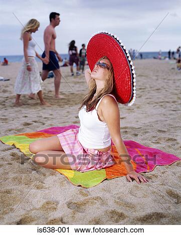 Woman sunbathing on beach View Large Photo Image Stock Image - Woman sunbathing on beach. Fotosearch