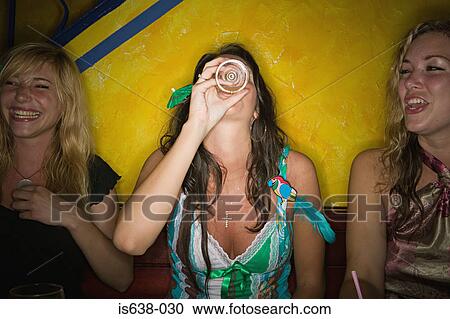 Stock Image - Women drinking in a bar. Fotosearch