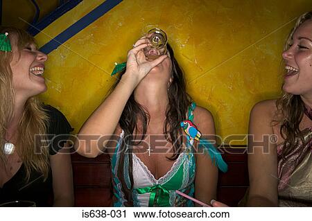 Women drinking in a bar View Large Photo Image Stock Image - Women drinking in a bar. Fotosearch