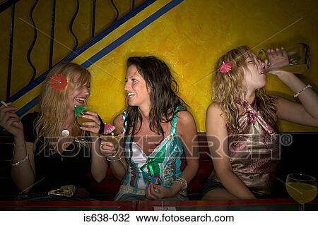 Women drinking in a bar View Large Photo Image Stock Image - Women drinking in a bar. Fotosearch