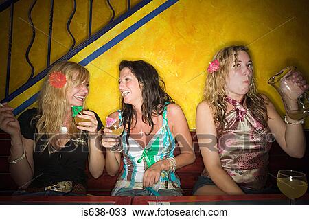 Women drinking in a bar View Large Photo Image Stock Image - Women drinking in a bar. Fotosearch