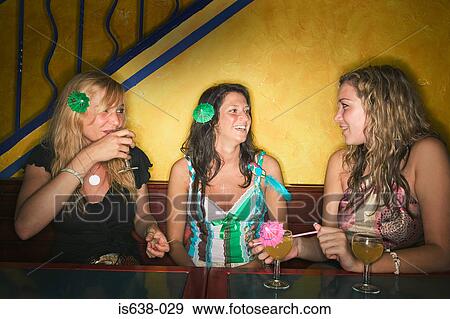 Women drinking in a bar View Large Photo Image Stock Photo - Women drinking in a bar. Fotosearch