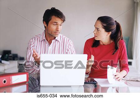Couple arguing over finances View Large Photo Image Picture - Couple arguing over finances. Fotosearch
