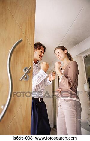 Couple inside their home View Large Photo Image Stock Photo - Couple inside their home. Fotosearch