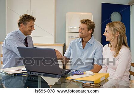 Couple meeting financial adviser View Large Photo Image Stock Photo - Couple meeting financial adviser. Fotosearch