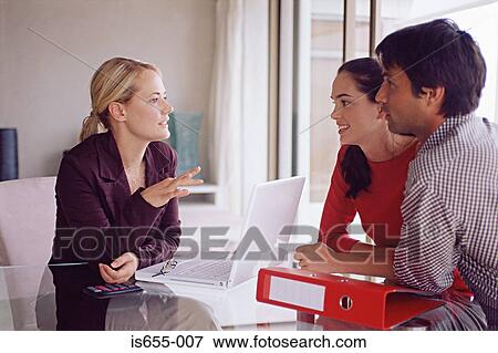 Couple meeting with a financial adviser View Large Photo Image Stock Photo - Couple meeting with a financial adviser. Fotosearch