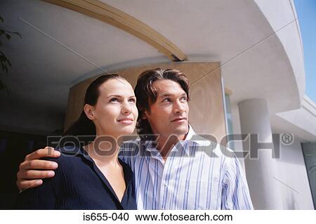 Couple outside their new house View Large Photo Image Stock Image - Couple outside their new house. Fotosearch