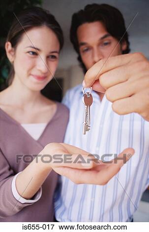 Stock Photo - Couple with keys. Fotosearch