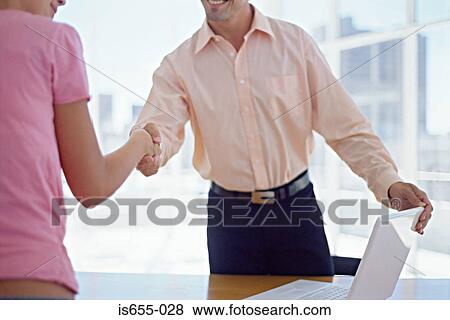 Man and woman shaking hands View Large Photo Image Stock Photo - Man and woman shaking hands. Fotosearch