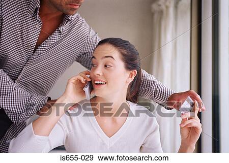 Man trying to take credit card from girlfriend View Large Photo Image Stock Photo - Man trying to take credit card from girlfriend. Fotosearch