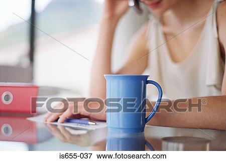 Woman dealing with her finances View Large Photo Image Stock Photo - Woman dealing with her finances. Fotosearch