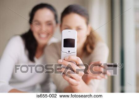 Women with mobile phone and credit card View Large Photo Image Stock Image - Women with mobile phone and credit card . Fotosearch