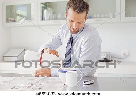 Businessman having breakfast View Large Photo Image Stock Image - Businessman having breakfast. Fotosearch