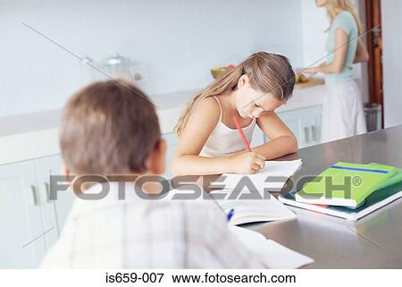 Children doing homework in the kitchen View Large Photo Image Stock Photo - Children doing homework in the kitchen. Fotosearch