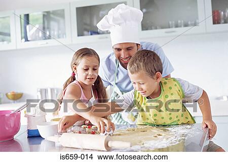 Picture - Father and children baking. Fotosearch