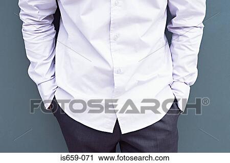 Man with his hands in his pockets View Large Photo Image Stock Image - Man with his hands in his pockets. Fotosearch