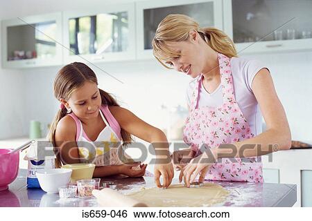 Mother and daughter making biscuits View Large Photo Image Stock Photograph - Mother and daughter making biscuits. Fotosearch