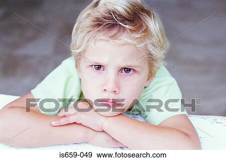 Stock Photo - Sulky boy. Fotosearch