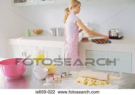 Woman baking in kitchen View Large Photo Image Stock Image - Woman baking in kitchen. Fotosearch