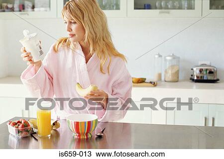 Woman having a healthy breakfast View Large Photo Image Stock Image - Woman having a healthy breakfast. Fotosearch