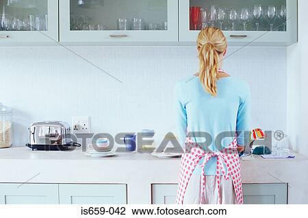 Woman washing up View Large Photo Image Stock Image - Woman washing up. Fotosearch