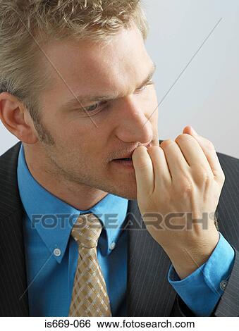 Businessman biting his nails View Large Photo Image Stock Photograph - Businessman biting his nails. Fotosearch