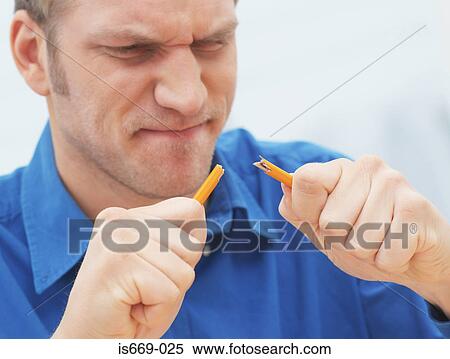 Stock Photography - Man breaking a pencil. Fotosearch