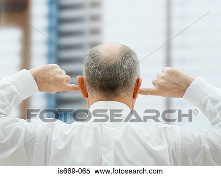 Man putting his fingers in his ears View Large Photo Image Stock Photography - Man putting his fingers in his ears. Fotosearch
