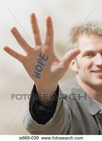 Man with hope written on his hand View Large Photo Image Stock Photo - Man with hope written on his hand. Fotosearch
