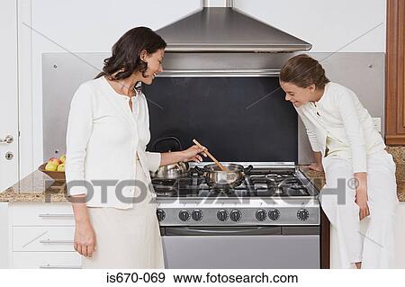 Mother and daughter cooking View Large Photo Image Stock Photo - Mother and daughter cooking. Fotosearch