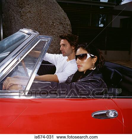 Stylish couple in a convertible  View Large Photo Image Stock Image - Stylish couple in a convertible . Fotosearch
