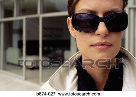 Woman in sunglasses View Large Photo Image Stock Photo - Woman in sunglasses. Fotosearch