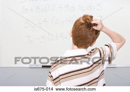 Picture - Boy puzzled by maths problem. Fotosearch