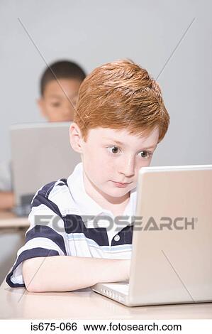 Boys using laptop computers View Large Photo Image Stock Photograph - Boys using laptop computers. Fotosearch