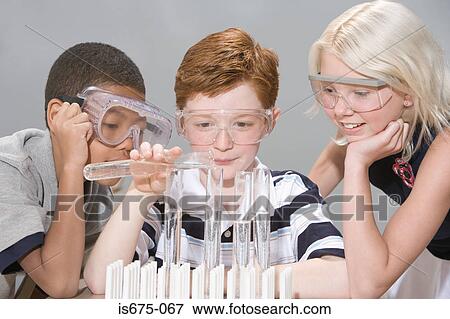 Stock Photo - Children doing an experiment. Fotosearch
