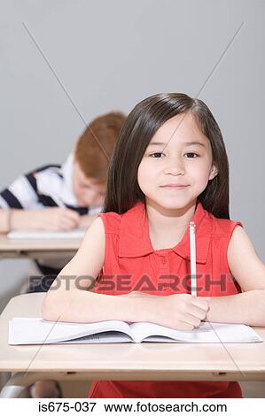 Stock Photo - Girl in class. Fotosearch