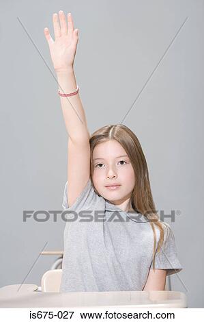 Girl raising her hand View Large Photo Image Stock Photo - Girl raising her hand. Fotosearch