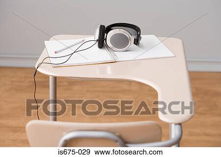Headphones on a desk View Large Photo Image Stock Photo - Headphones on a desk. Fotosearch